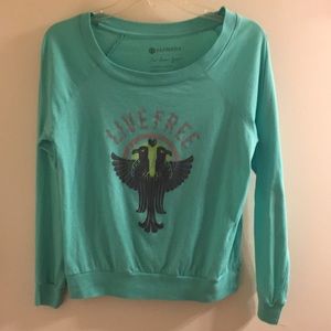 “Live Free” aqua colored shirt